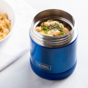 Thermos on a table with food inside